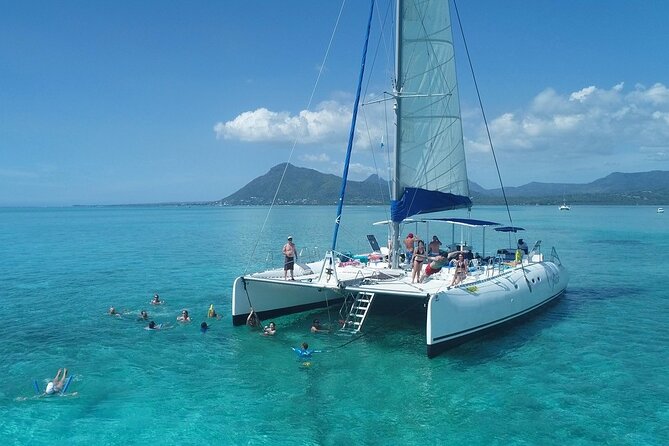 Full Day Catamaran Cruise on shared basis to Bénitiers Island - Leaving Grande Rivière Noire for Tamarin Bay