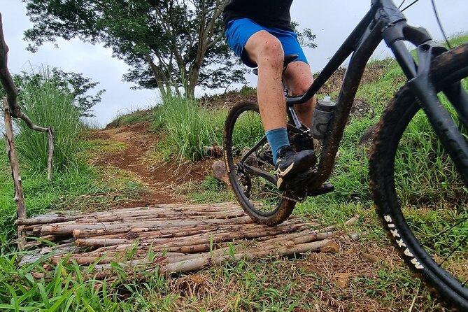 Private Mountain Biking Experience in the Wild South of Mauritius - Views of the lagoon, mountains, and waterfall